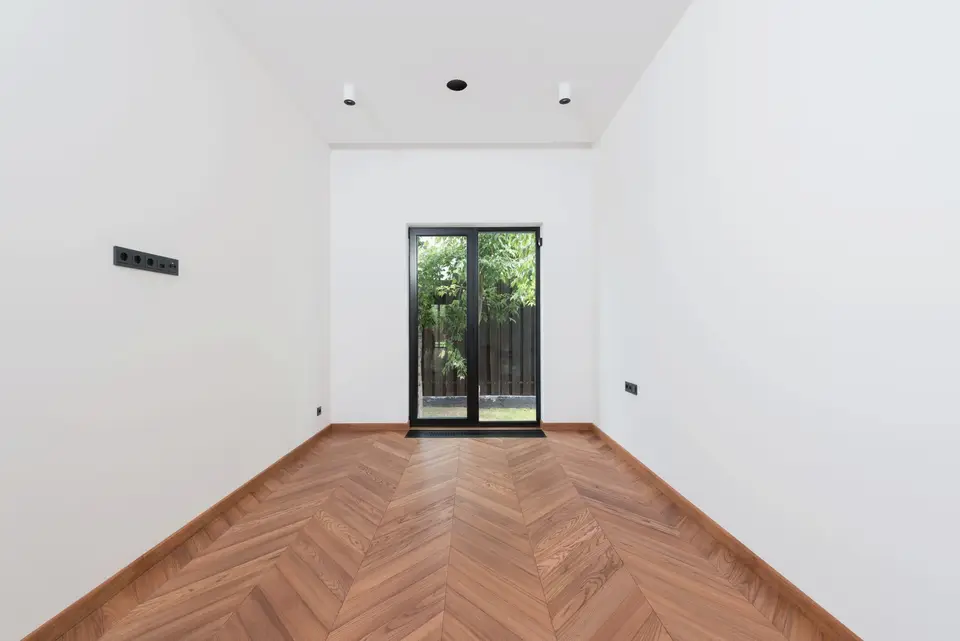Wooden Floor and White Walls Inside a House